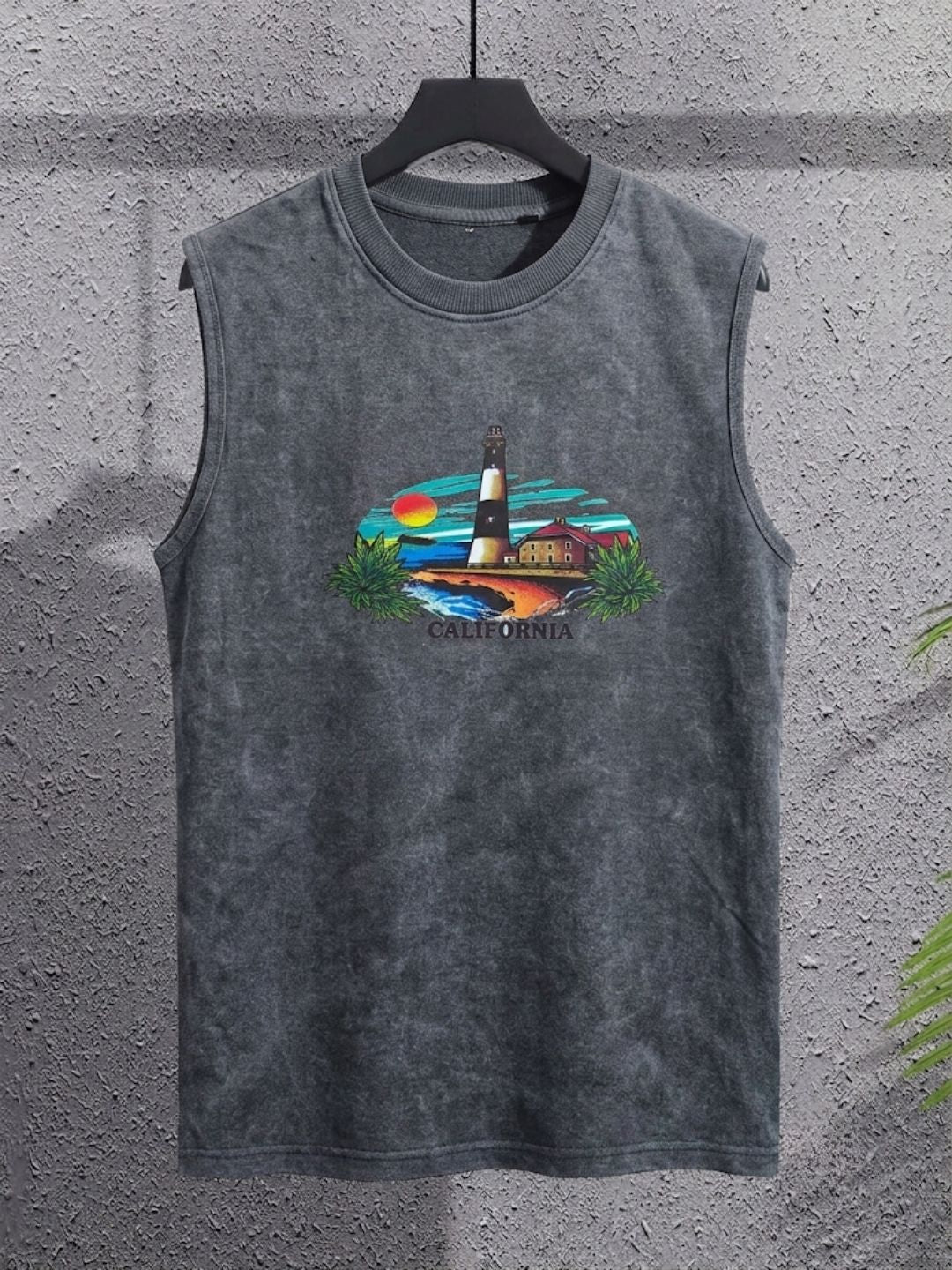 Charcoal grey acid wash muscle tank top featuring a retro California coastal scene and lighthouse graphic by The Modvue.